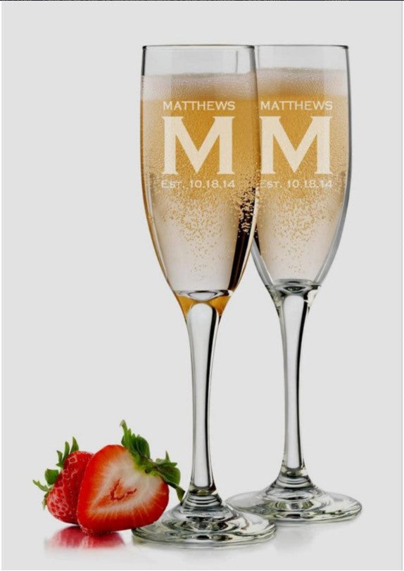 Set of 2 Engraved Champagne Glasses.