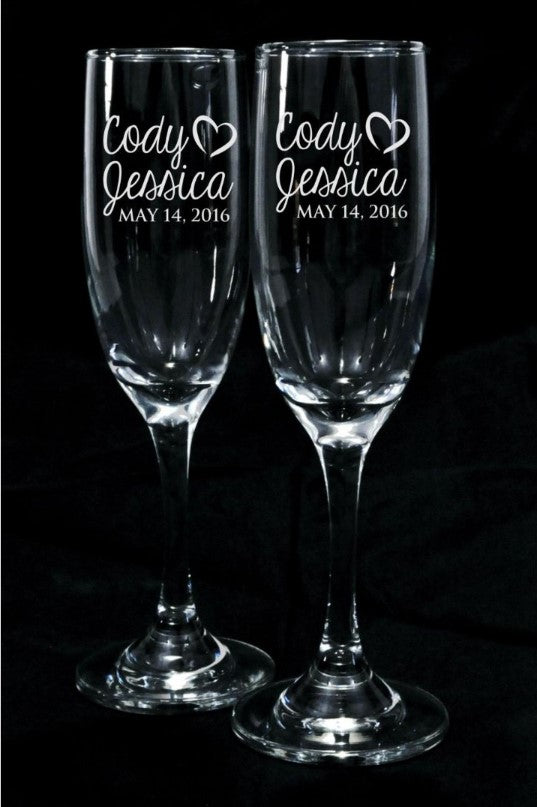Set of 2 Engraved Champagne Glasses.