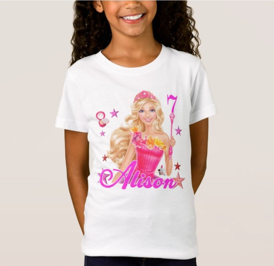 Celebrate in pink with this dazzling birthday tee! Featuring the iconic Barbie logo and bright colors, this shirt adds vibrant fun to any celebration. Perfect for young dreamers who love adventure and style. Choose your size and let the birthday magic begin!  Alt text: Pink birthday T-shirt with the Barbie logo.